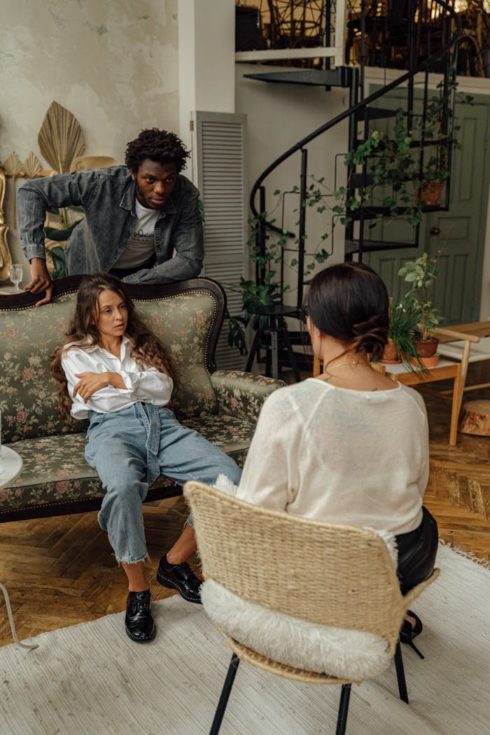 Intimate family therapy session in a stylish and cozy loft setting.